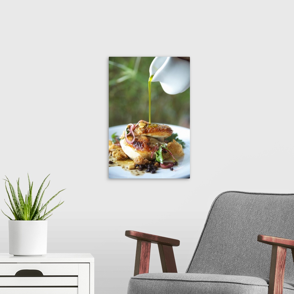 A modern room featuring Hawaii, Olive Oil Being Poured Over Delicious Chicken Dish.