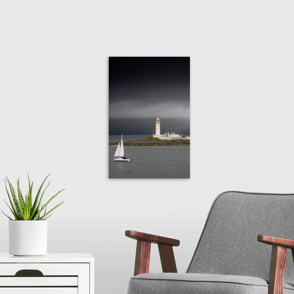 A modern room featuring Sailboat Near A Shore With A Lighthouse; Eilean Musdile In The Firth Of Lorn, Scotland