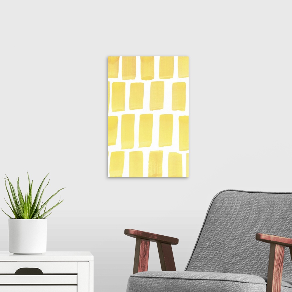A modern room featuring Contemporary abstract painting vertical wide strokes of yellow against a white background.