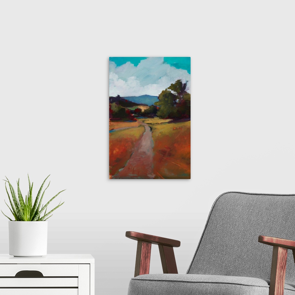 A modern room featuring Landscape painting of a country road surrounded by grass, trees, and rolling hills in Autumn colors.