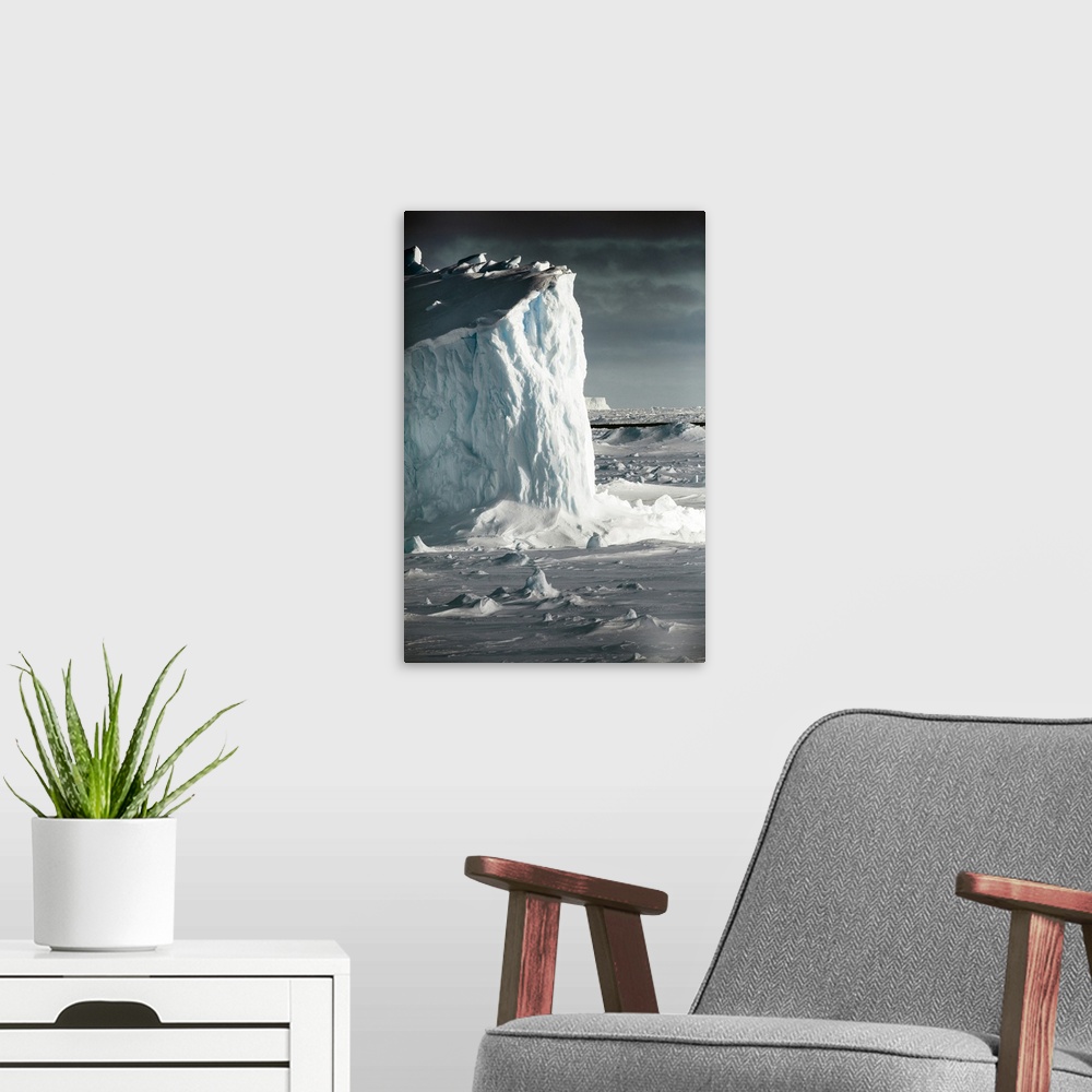 A modern room featuring Antarctica. Iceberg at sunrise surrounded by sea ice.