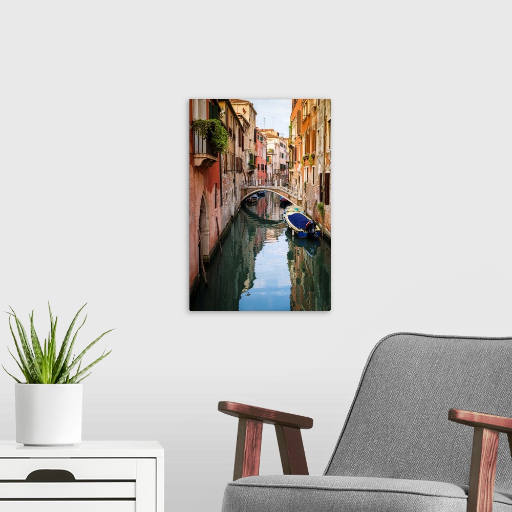 A modern room featuring Canal and houses, Venice, Veneto, Italy.