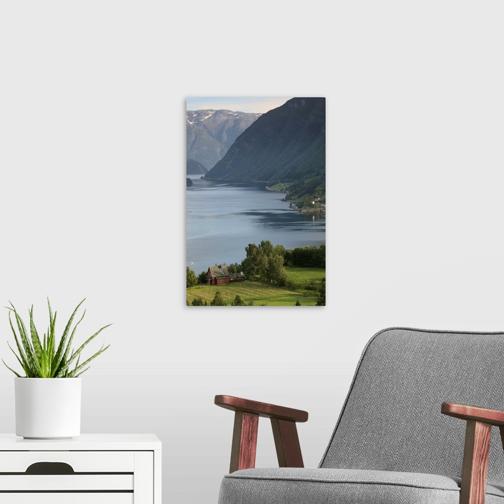 A modern room featuring evening light settles upon Ulvik and the shores of Hardanger Fjord, Norway