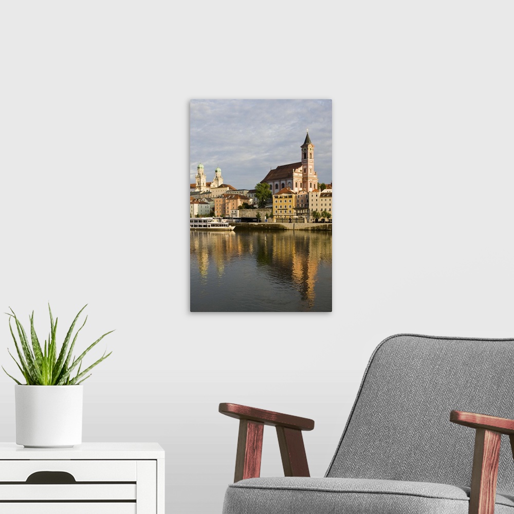 A modern room featuring Germany, Bayern-Bavaria, Passau. Danube River View with St. Paul church, sunset.