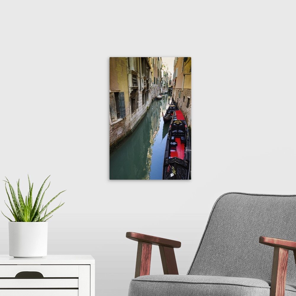 A modern room featuring Gondolas and canal, Venice, Veneto, Italy.