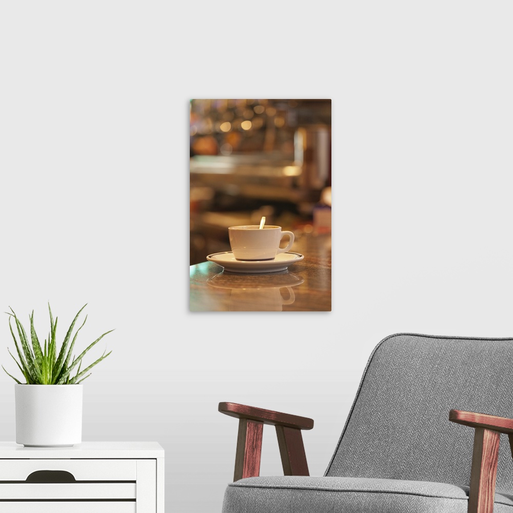 A modern room featuring Italy, Venice. A cup of coffee and surrounding ambience of a cafe.