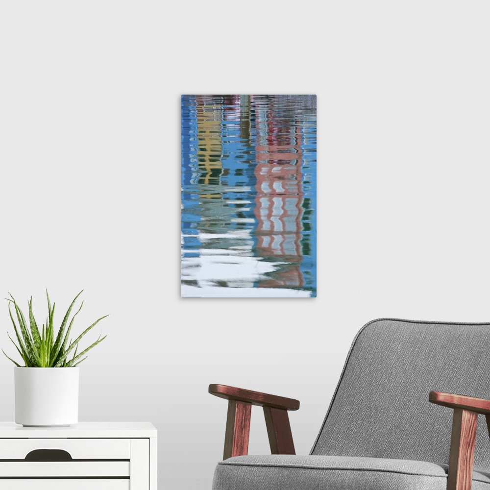 A modern room featuring Italy, Venice, Burano. Multicolored houses reflected in water.