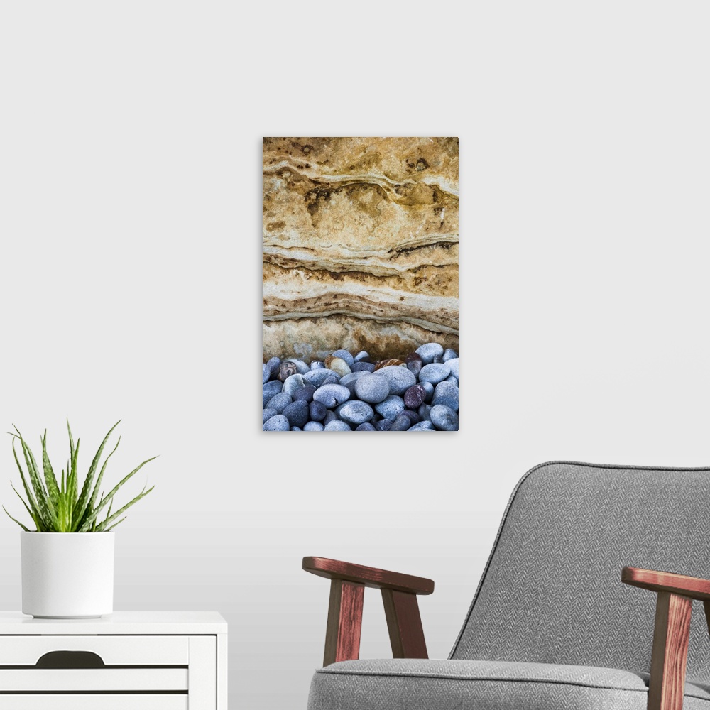 A modern room featuring North America, USA, Michigan, Pictured Rock National Lakeshore.  Weathered beach rocks against sa...