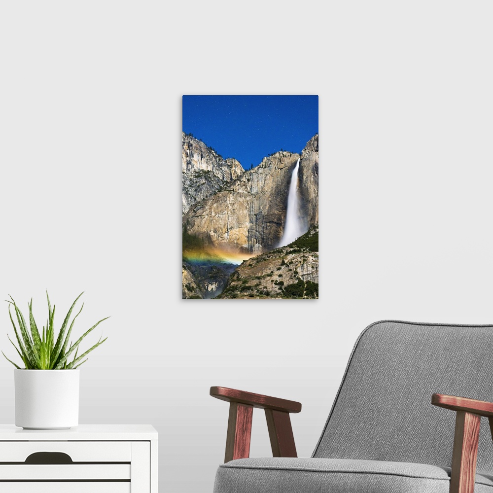 A modern room featuring Moonbow and starry sky over Yosemite Falls, Yosemite National Park, California