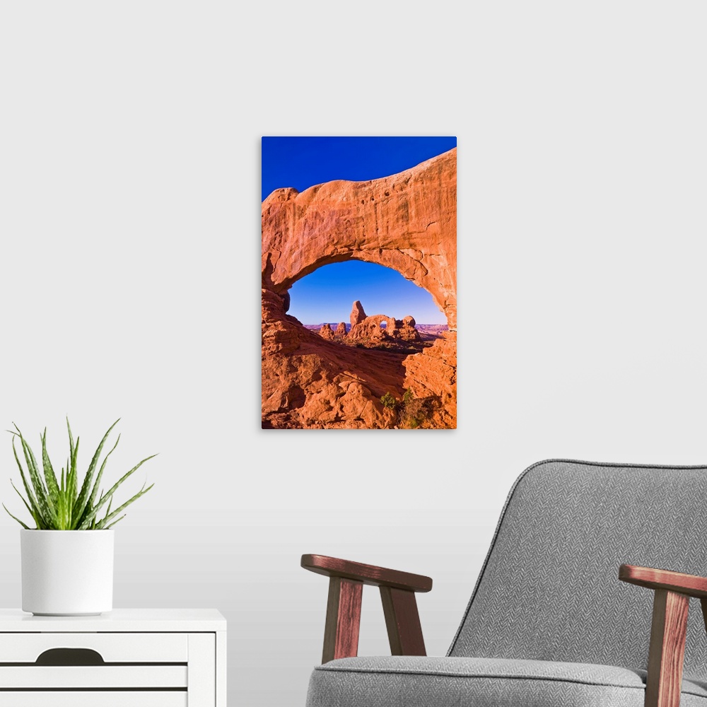 A modern room featuring Morning light on Turret Arch through North Window, Arches National Park, Utah USA