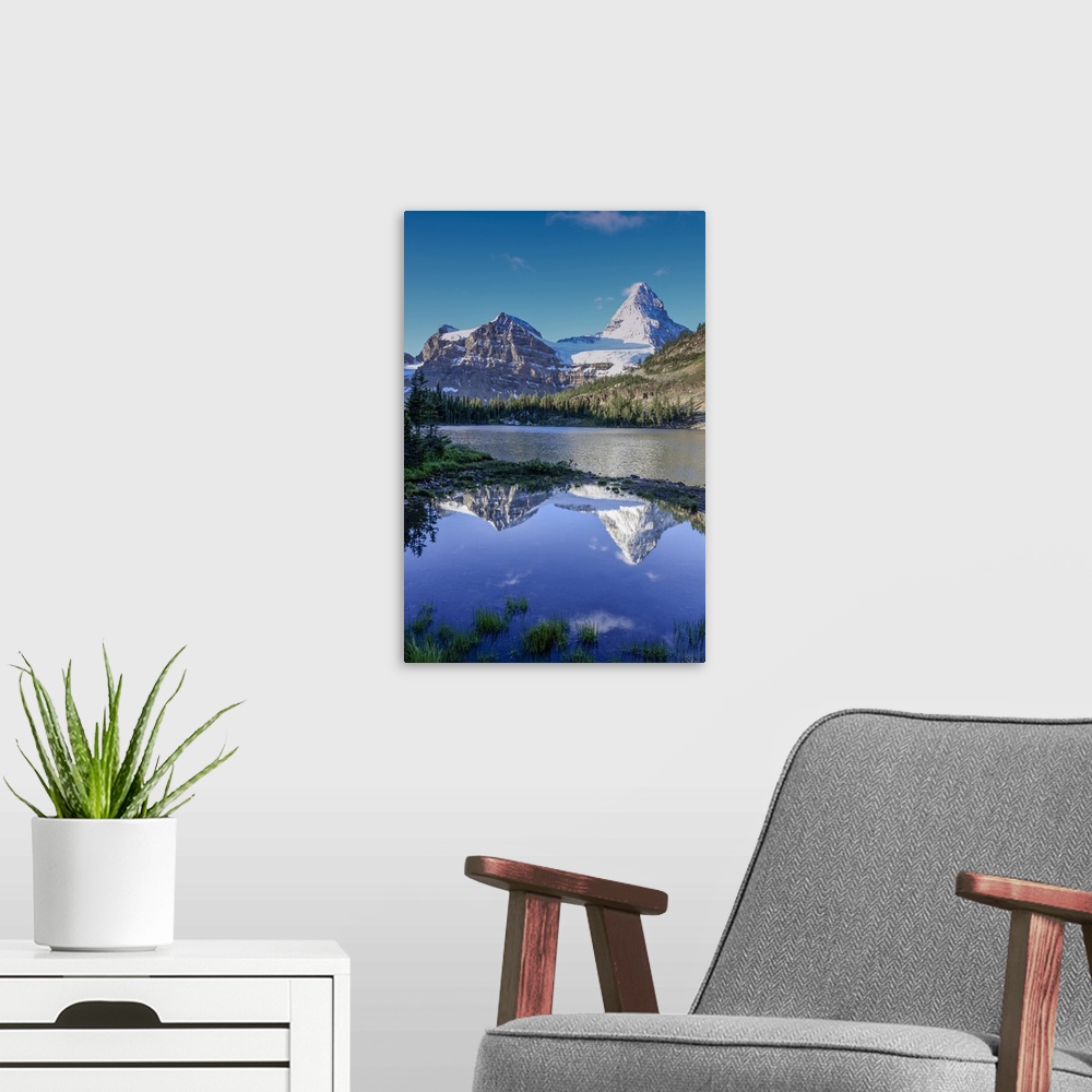 A modern room featuring Mount Assiniboine and Mount Magog as seen from Sunburst Lake.