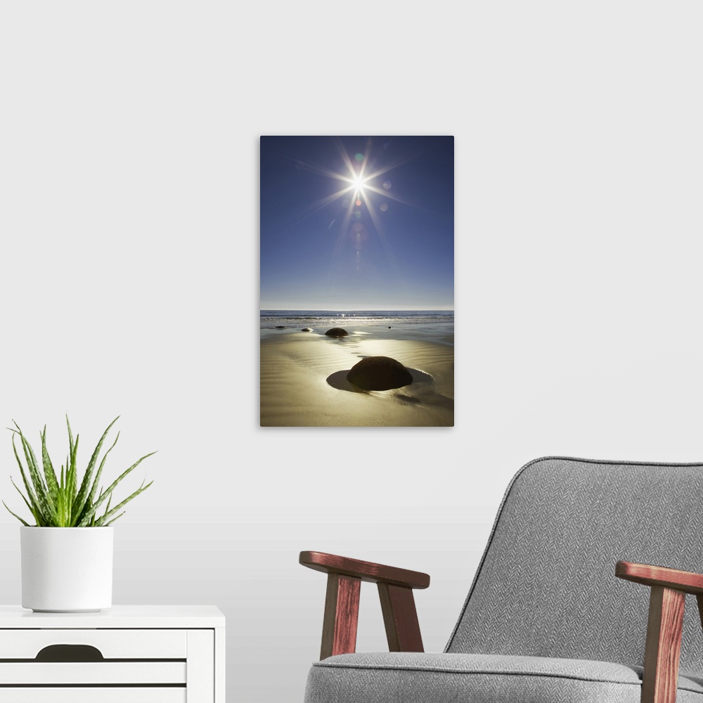 A modern room featuring New Zealand, South Island. Starburst over Moeraki Boulders Scenic Reserve.