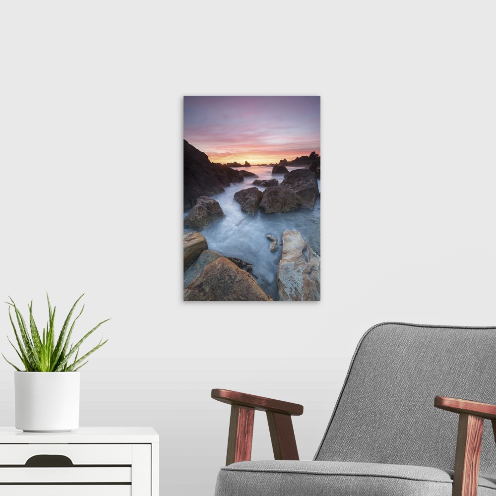 A modern room featuring North America, USA, Oregon. Sunset and incoming tide at Harris Beach State Park, ORrocks at arch,...