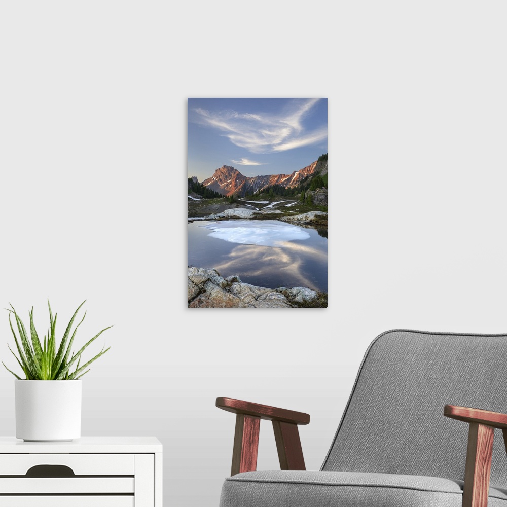 A modern room featuring Partially thawed tarn, Yellow Aster Butte Basin. American Border Peak and Yellow Aster Butte in t...