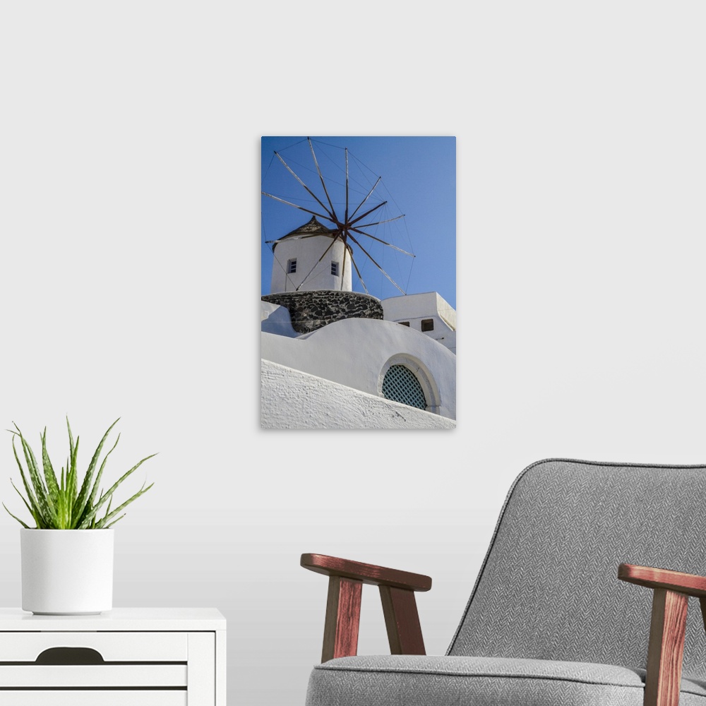 A modern room featuring Santorini, Greece. White Washed Buildings and the Aegean Blue Sky.