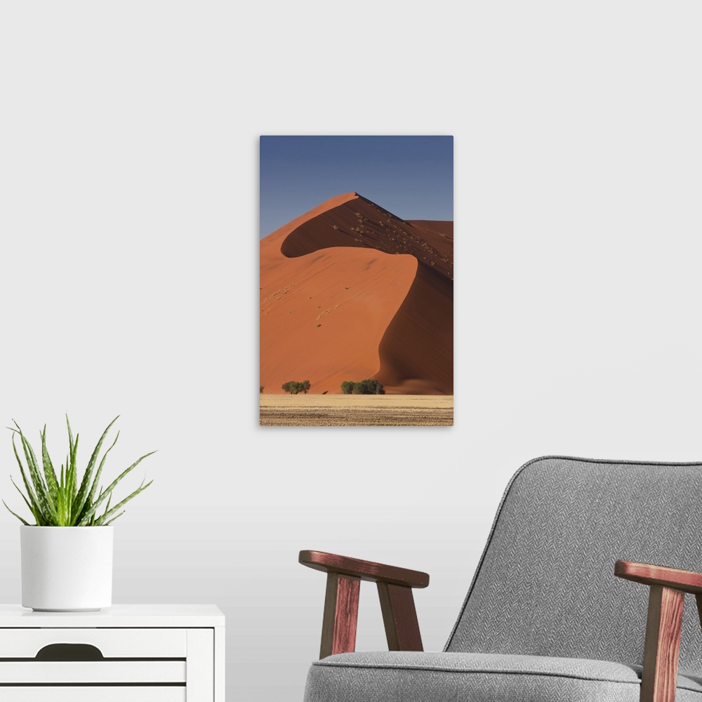 A modern room featuring Sossusvlei, Namibia. Red Sand Dunes.