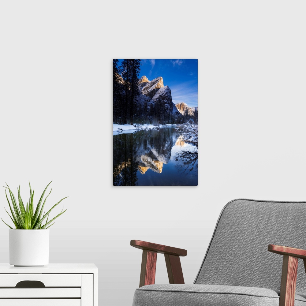 A modern room featuring The Three Brothers above the Merced River in winter, Yosemite National Park, California USA.