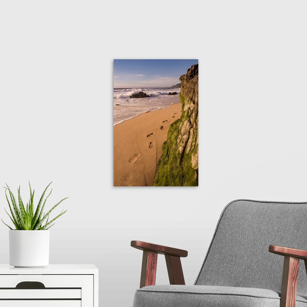A modern room featuring Footprints and sand beach along the California Coast, Garapata Beach, California, USA.