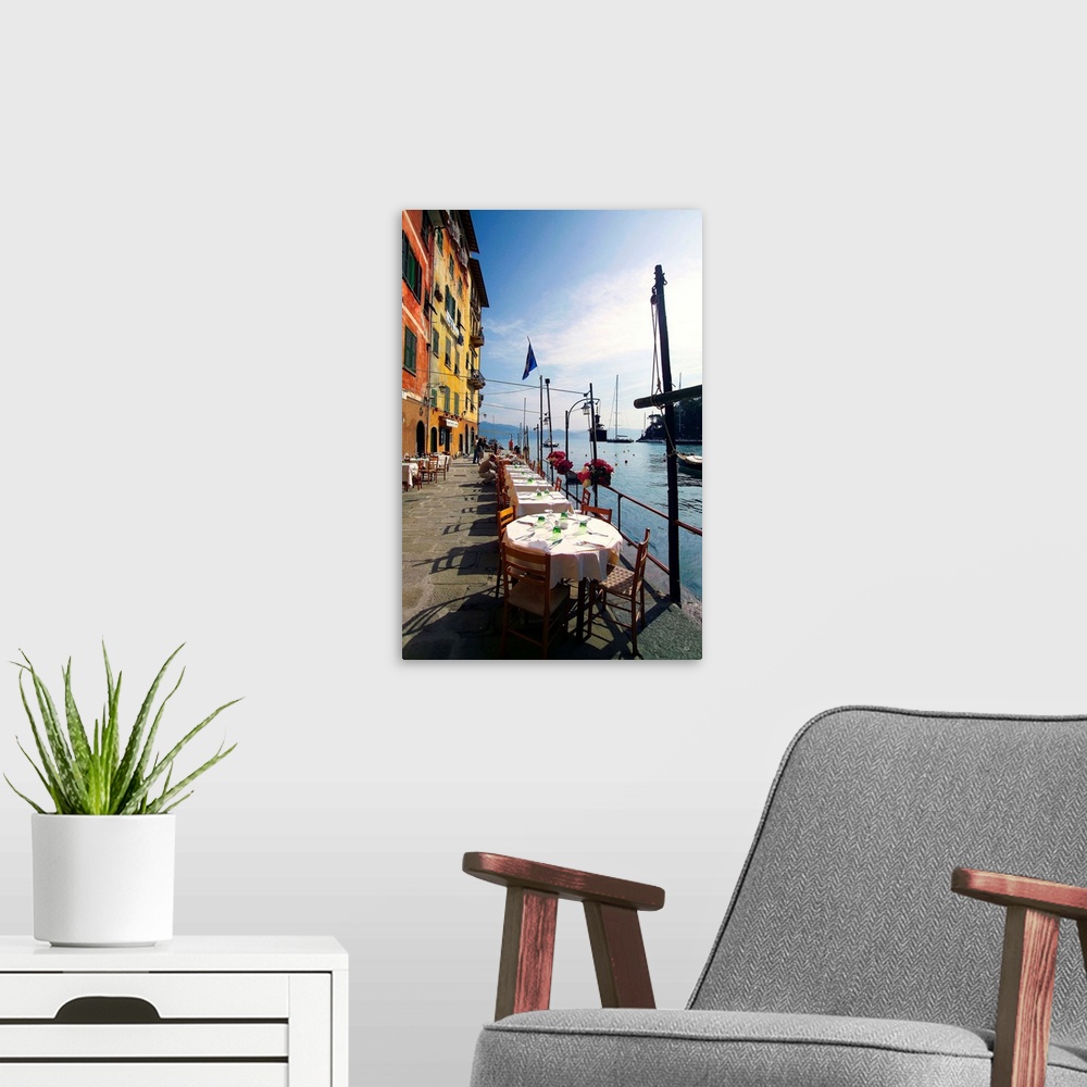A modern room featuring Italy, Liguria, Portofino, Tables along the harbor side.