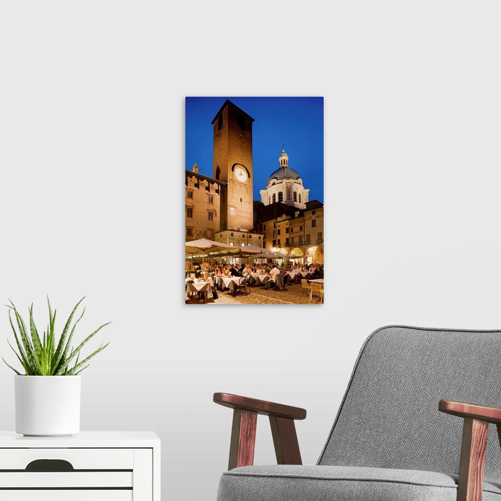 A modern room featuring Italy, Italia, Lombardy, Lombardia, Mantua, Mantova, Piazza Broletto, the clock tower of the Pala...