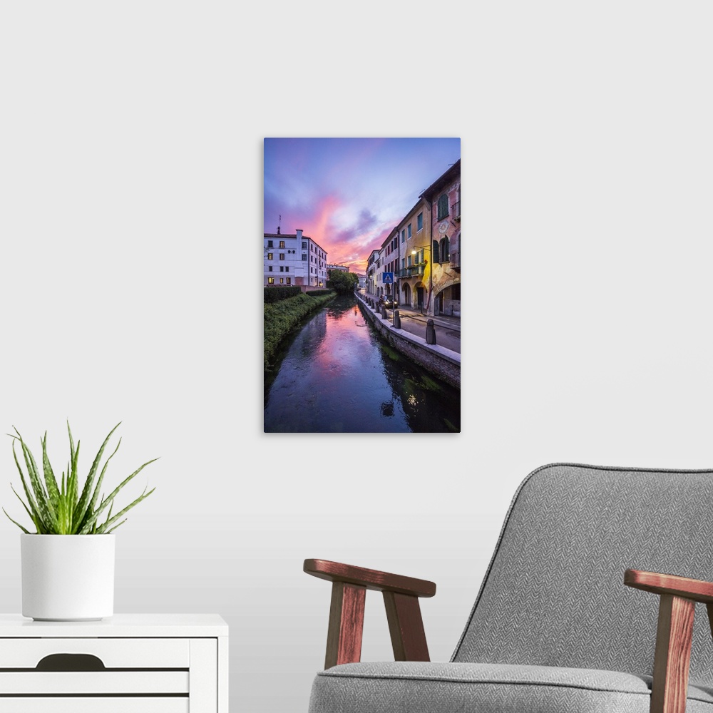 A modern room featuring Italy, Veneto, Mediterranean area, Treviso district, Treviso, Buranelli canal at sunset