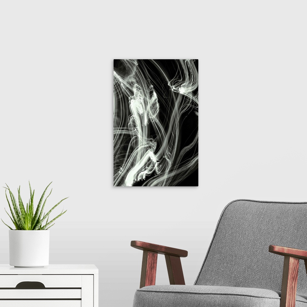 A modern room featuring Long exposure abstract photograph of white light trails giving a smokey look with a black backgro...