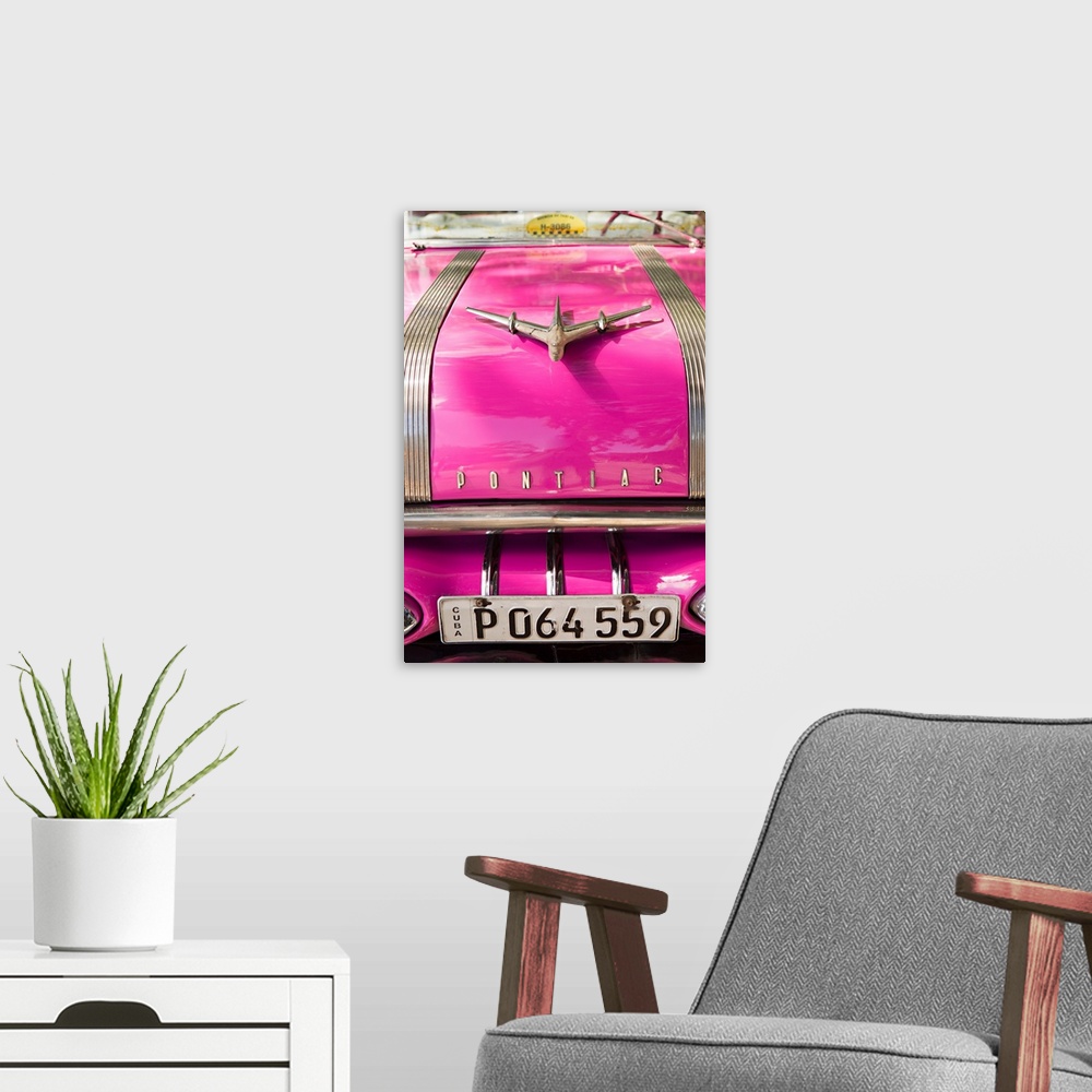 A modern room featuring Photograph of the front of a hot pink vintage Pontiac car in Cuba.