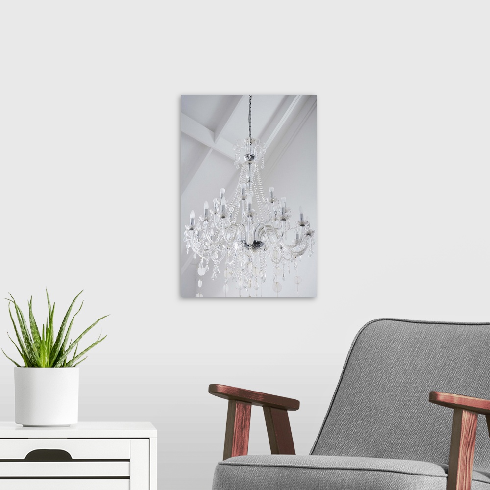 A modern room featuring A chandelier with crystal prisms