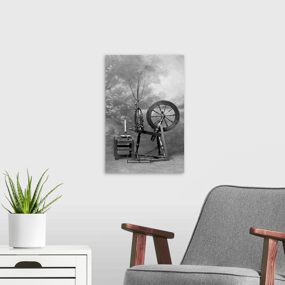 A modern room featuring Old time spinning wheel. Photograph, undated. BPA2