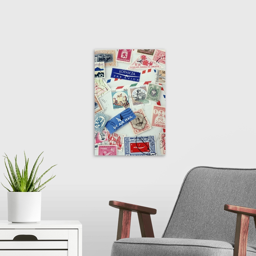 A modern room featuring Assorted stamps from various countries, overhead view