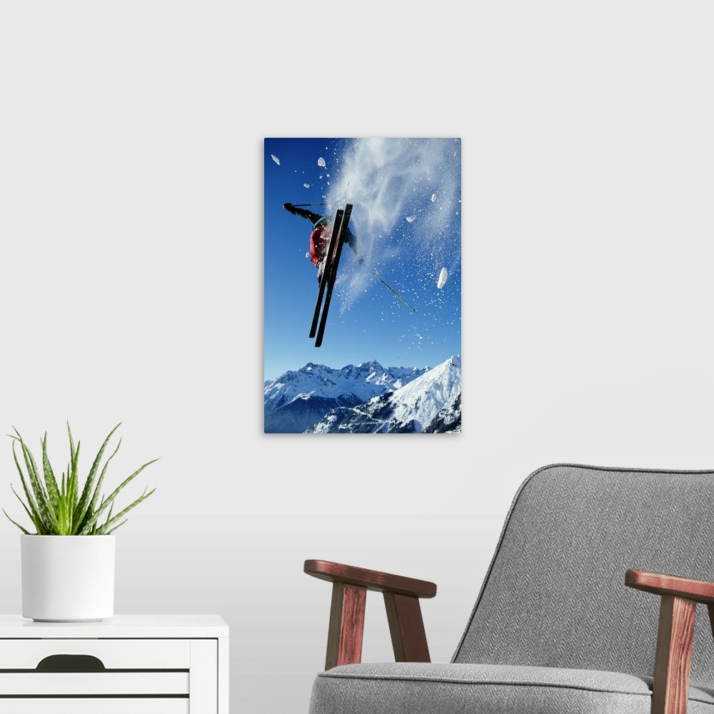 A modern room featuring Downhill skier in mid-air, rear view