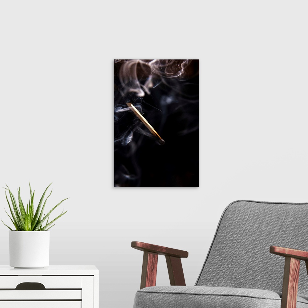 A modern room featuring Extinguished Smoking Match on Black Background