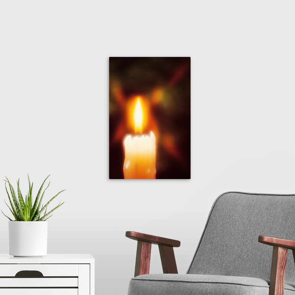 A modern room featuring Lit candle