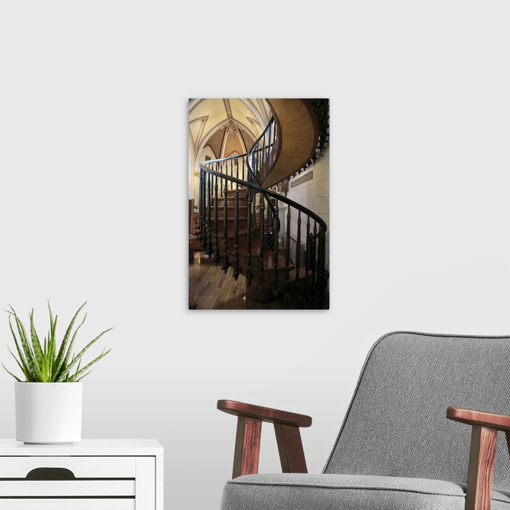 A modern room featuring A closed up view of the Miraculous Staircase inside of Loretto Chapel