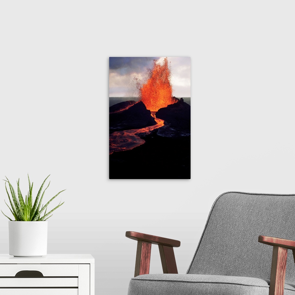 A modern room featuring Puu Oo, the easternmost of Kilauea's craters, spews molten lava.