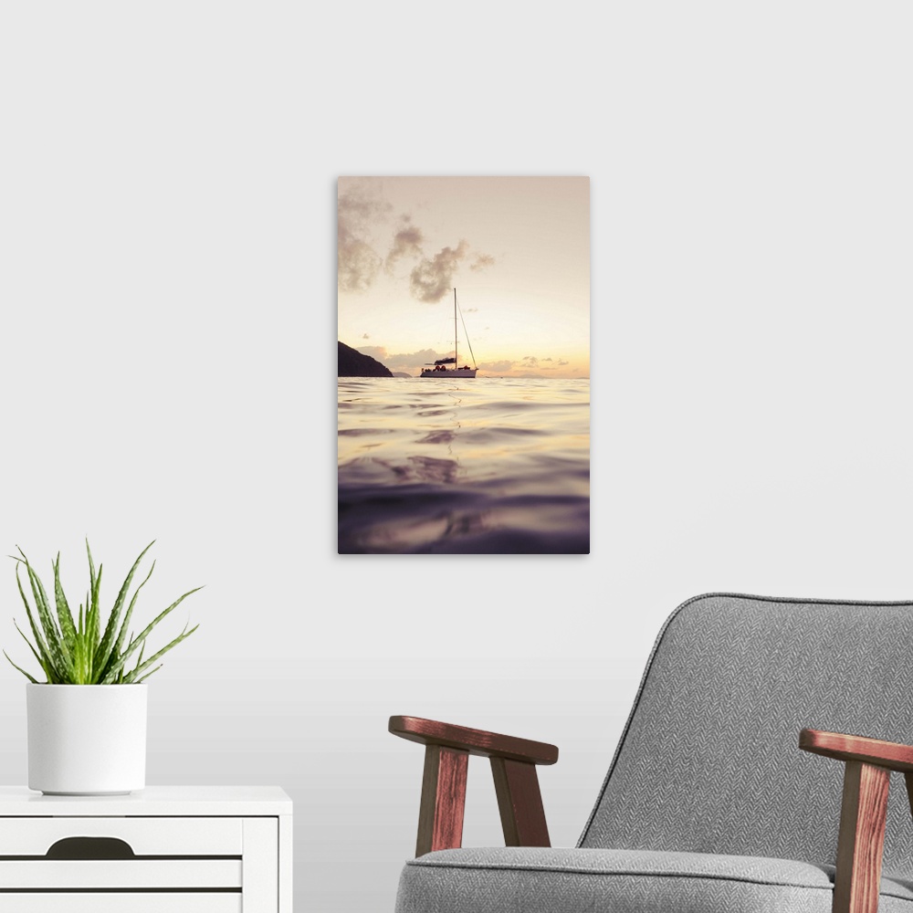 A modern room featuring Sailing boat against sunset
