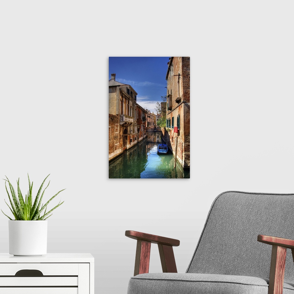 A modern room featuring Boat in a small canal in Venice