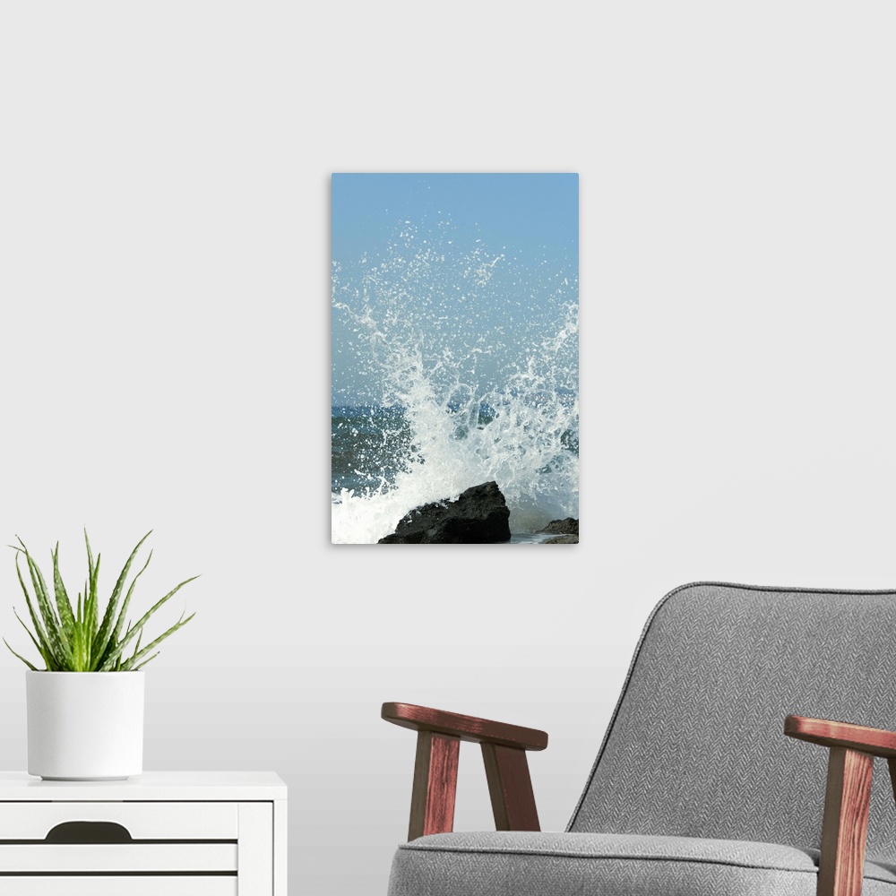 A modern room featuring Waves breaking on rocks