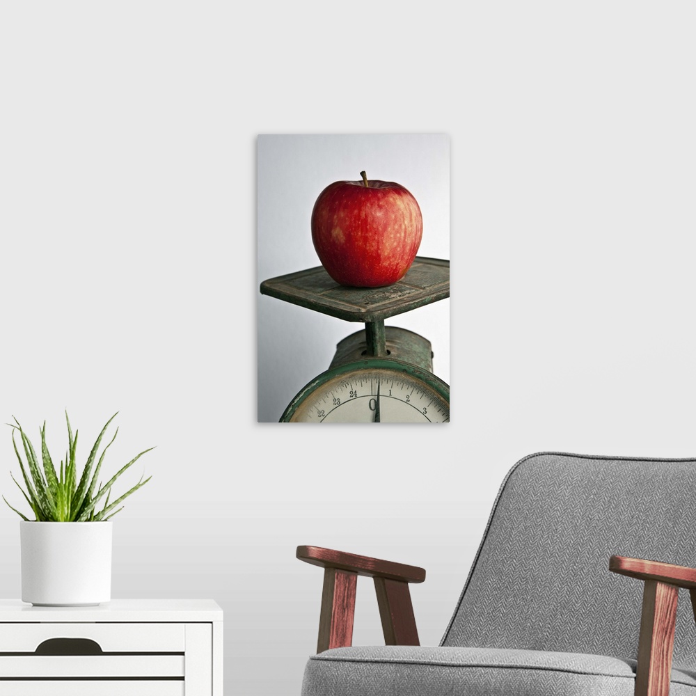 A modern room featuring Weighing an apple on an old scale