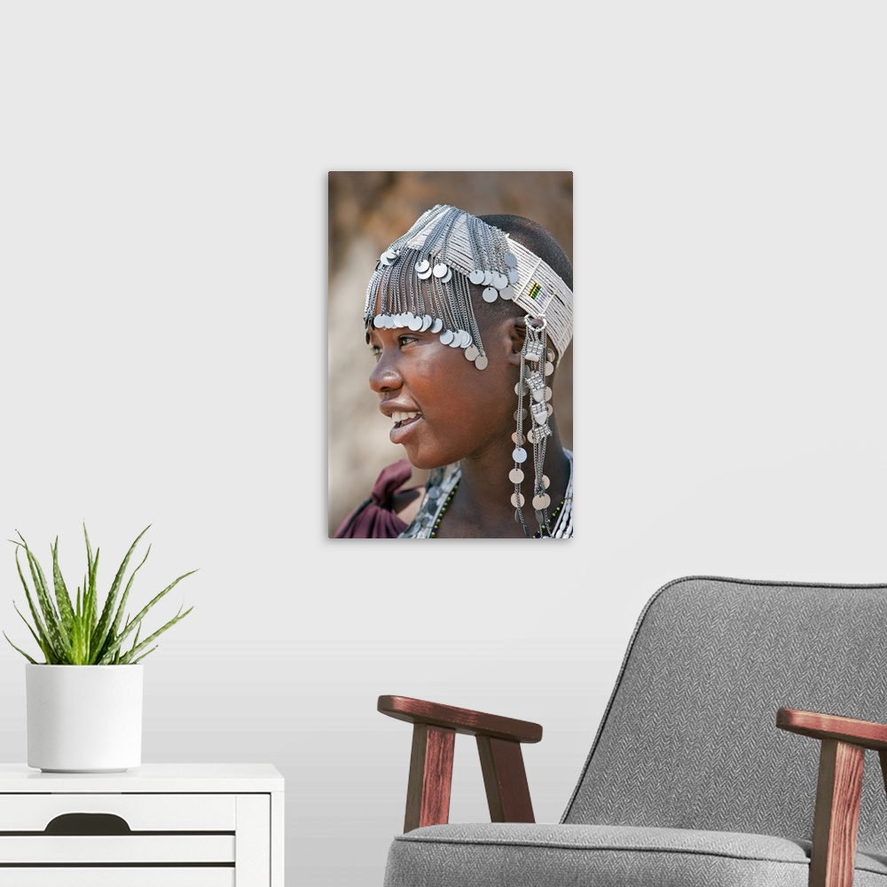 A modern room featuring A Maasai girl from the Kisongo clan wearing an attractive beaded headband.