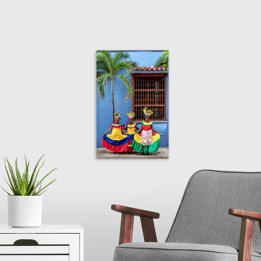 A modern room featuring Colourful Palenqueras selling fruits on the street of Cartagena, Bolivar Department, Colombia (MR).
