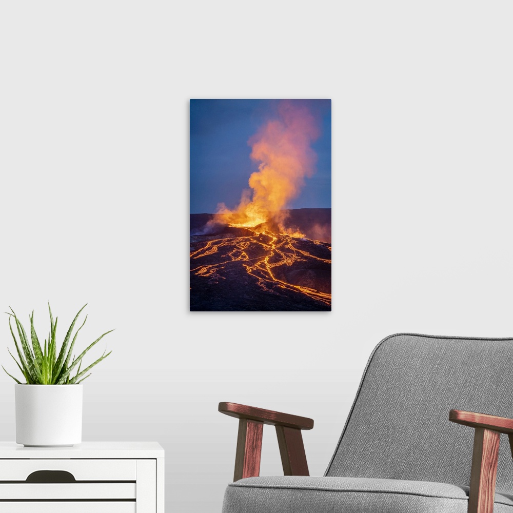 A modern room featuring Fagradalsfjall volcano eruption at twilight, Geldingadalir, Reykjanes Peninsula, Iceland.