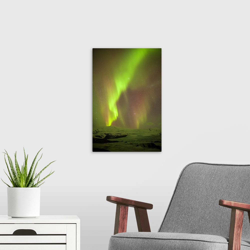 A modern room featuring Iceland, Fjallsarlon. The Northern Lights appearing in the sky at Fjallsarlon, a glacier lake at ...