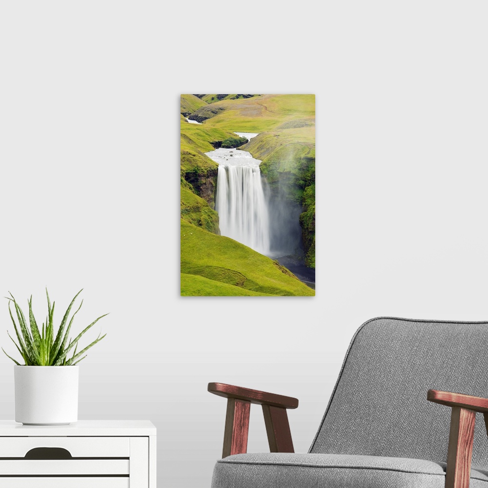 A modern room featuring Iceland, southern region, Skogafoss waterfall.