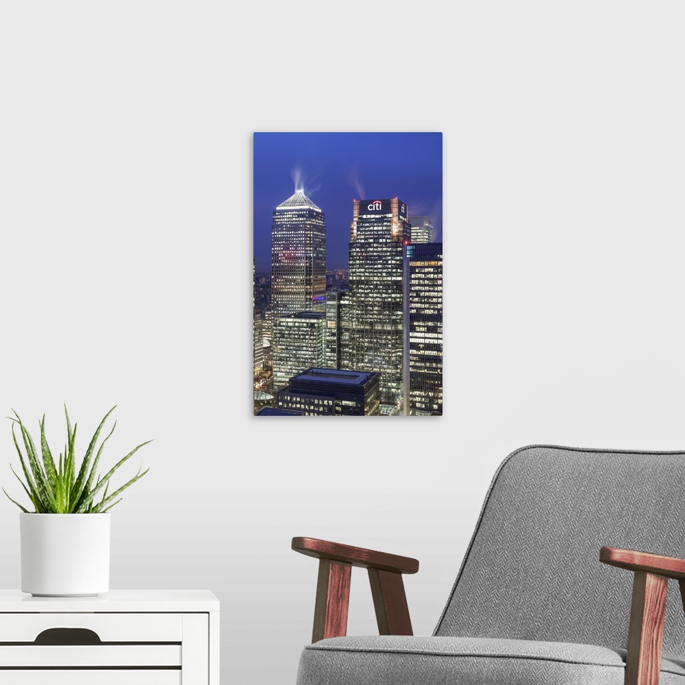 A modern room featuring The new London financial district in the docklands at dusk.