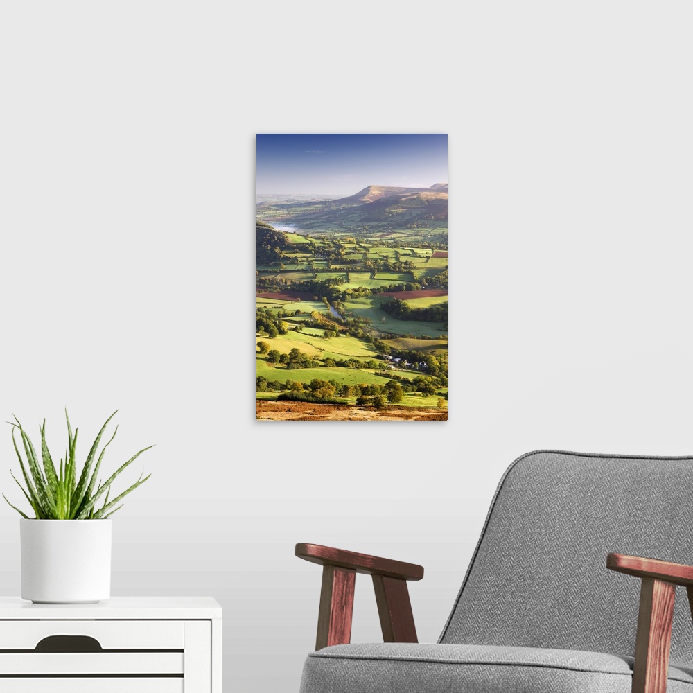 A modern room featuring The River Usk and rolling countryside in the Brecon Beacons National Park, Powys, Wales, UK. Autu...