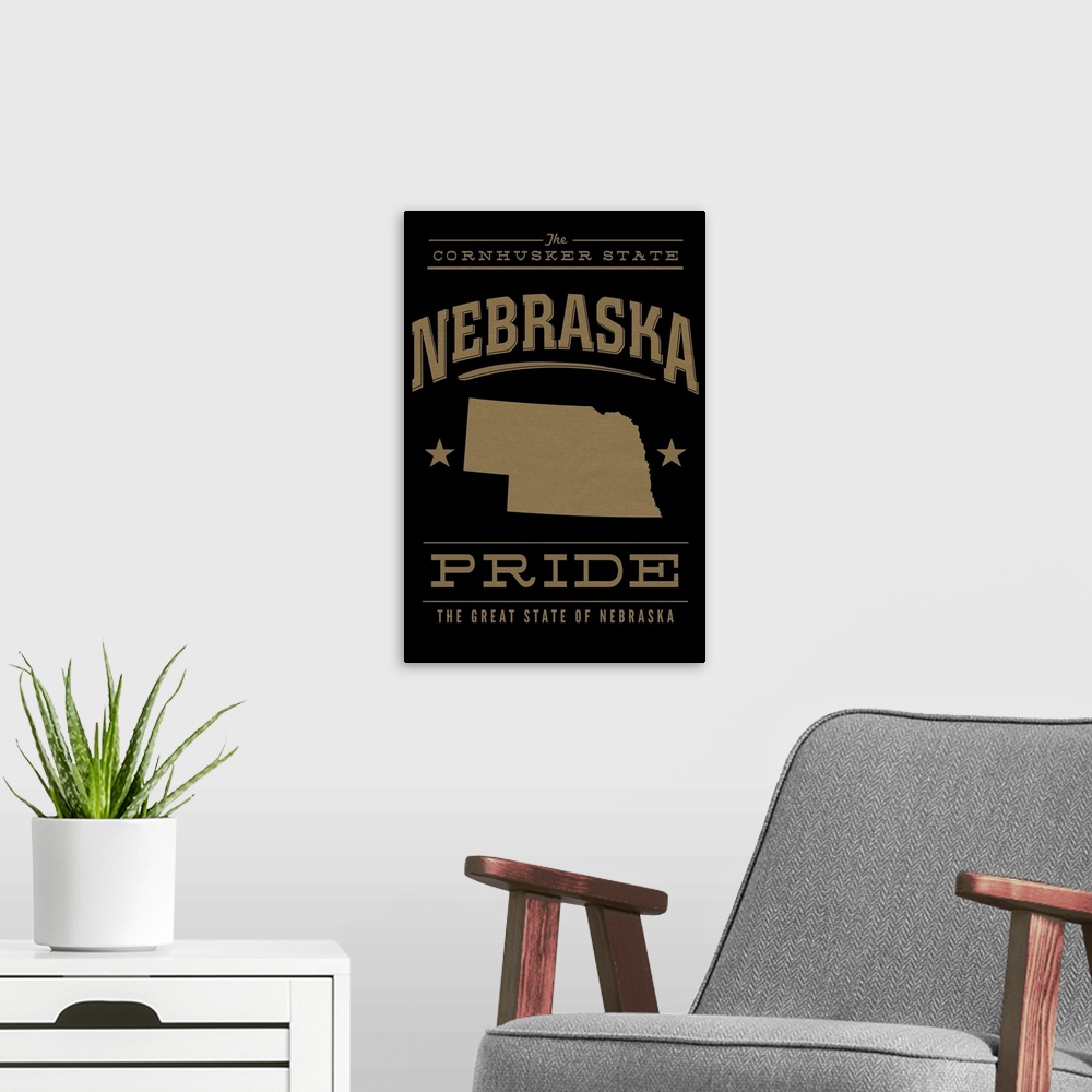 A modern room featuring The Nebraska state outline on black with gold text.