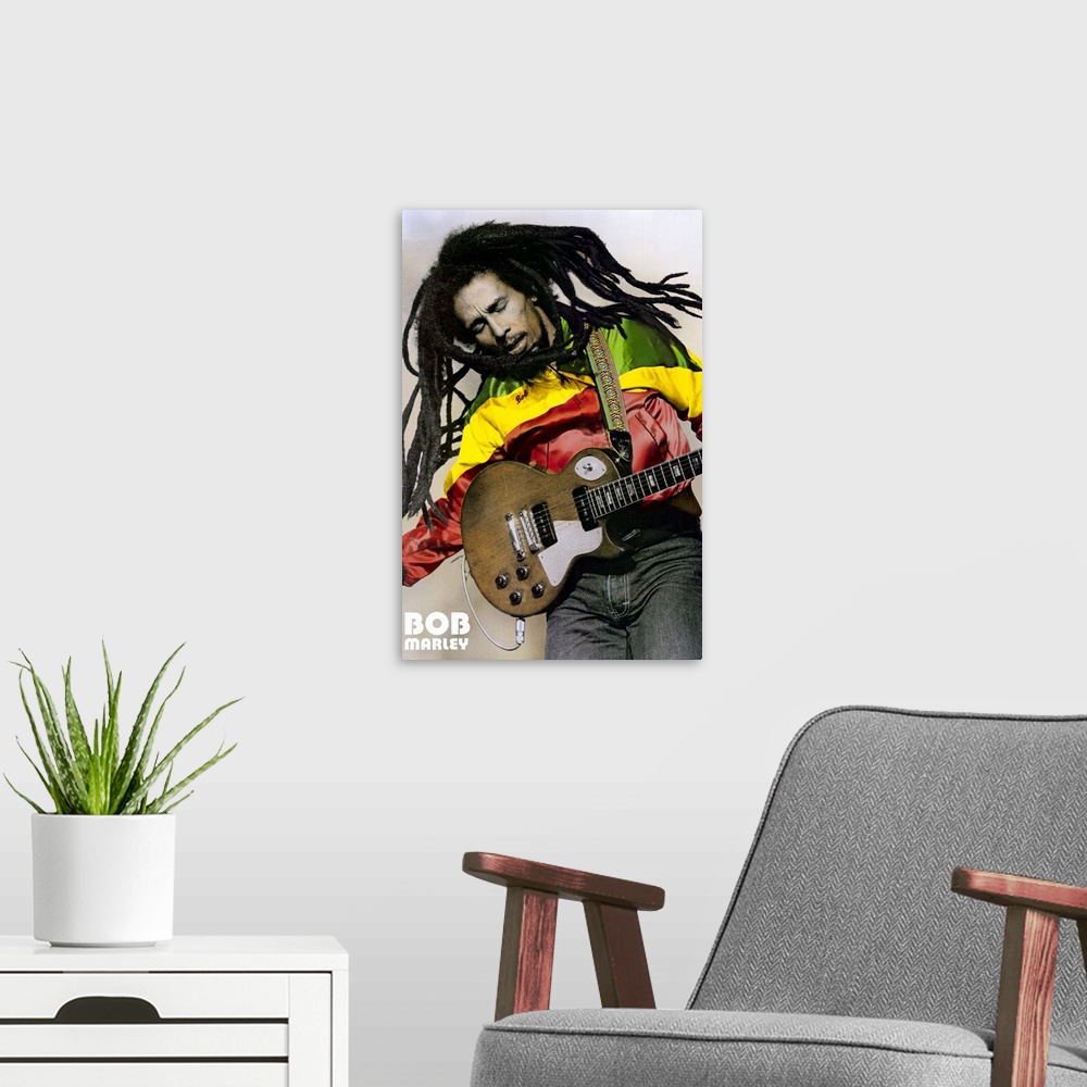 A modern room featuring Large, portrait photograph of Bob Marley playing guitar, his name in the bottom left corner.