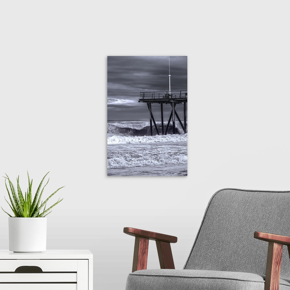 A modern room featuring Pier over rough ocean waters during a storm in New Jersey.