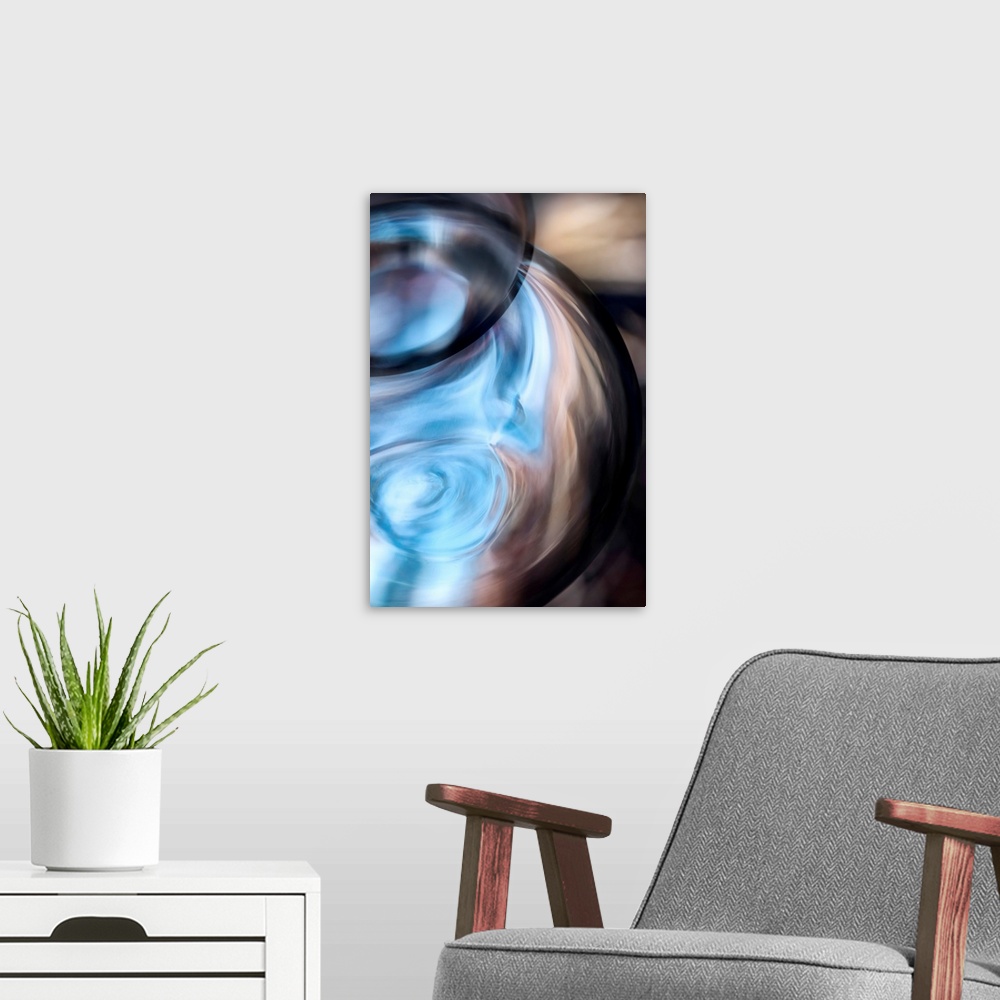 A modern room featuring Tall abstract photo on canvas of the up close of a vase.
